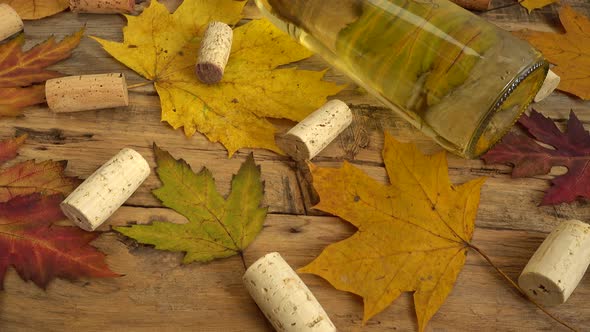 Wine bottles and corks on an old vintage wooden board