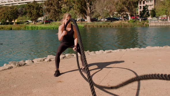 Very Athlete Woman Works Out In The Park