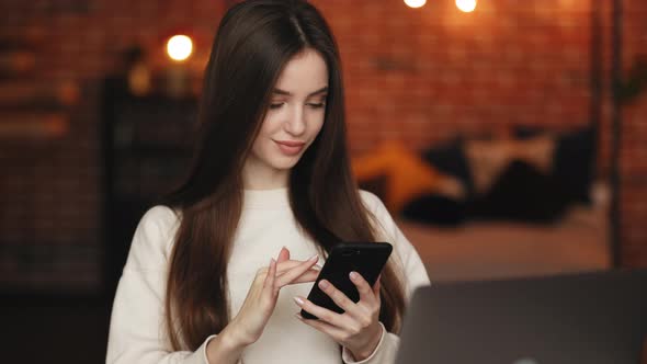 A Woman is Sitting in Her Home Office