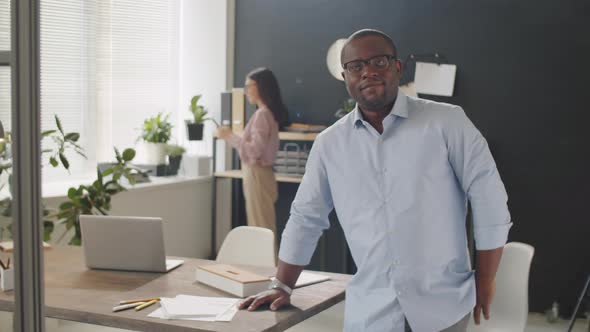 Happy Afro-American Businessman Posing for Camera in Office