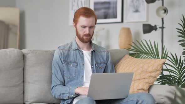 Man with Neck Pain Working on Laptop