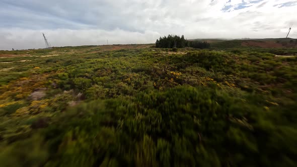 FPV Racing Drone Flying Over an Open Field on Madeira Portugal