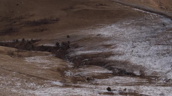 Car in the Mountains of the Caucasus in Winter