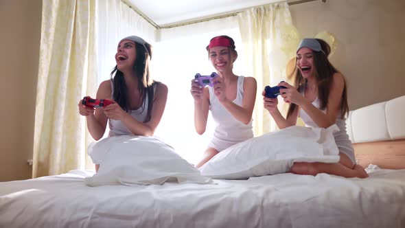 Smiling Women Playing with Video Game with Joystick.