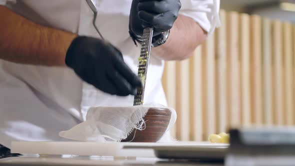 The Chef Processes the Celery Root Into Small Pieces