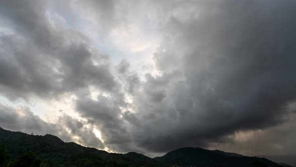 Timelapse footage of dark clouds flowing over sea