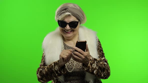 Elderly Stylish Trendy Caucasian Grandmother Woman Using Smartphone. Chroma Key