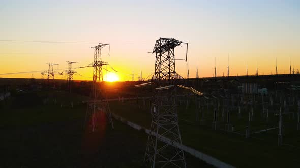 Silhouette High Voltage Electric Tower on Sunset Time and Sky on Sunset Time Background