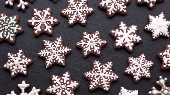 Rotating Gingerbread Cookies Snowflakes on Slate Table