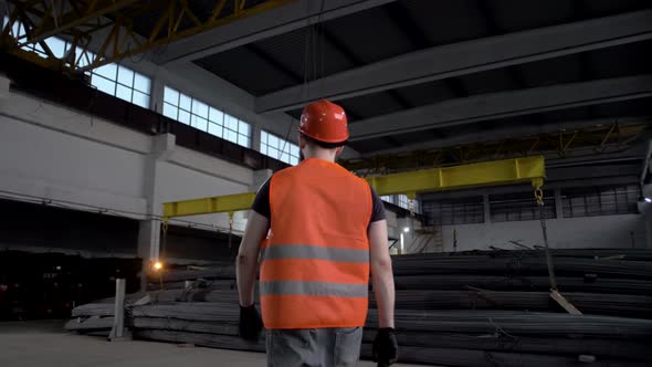 Professional engineer confidently walks around the plant and the light gradually turns on