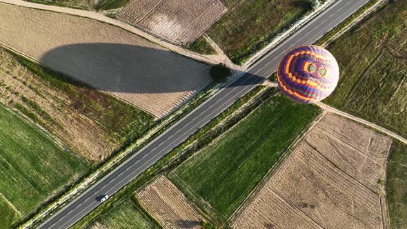 4K Aerial view of Goreme. Colorful hot air balloons fly over the valleys.