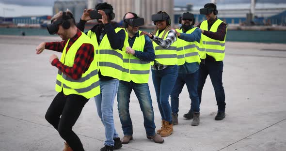 Multiracial workers using virtual reality headsets at industrial terminal Port