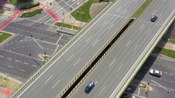 Highway aerial with cars and truck lorrying aerial view 4k. Four lane local road traffic transport v