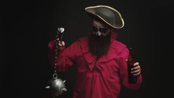 Man Dressed Up Like a Drunk Pirate Over Black Background