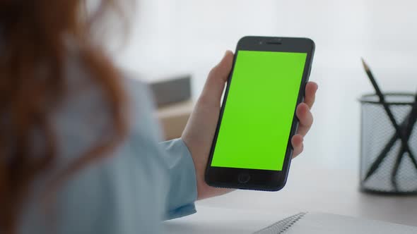 Zoom in Shot of Unrecognizable Little Girl Holding Smartphone with Green Chroma Key Screen and