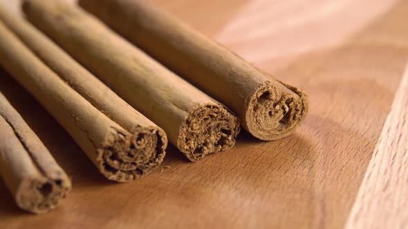 Cinnamon sticks on a wooden surface