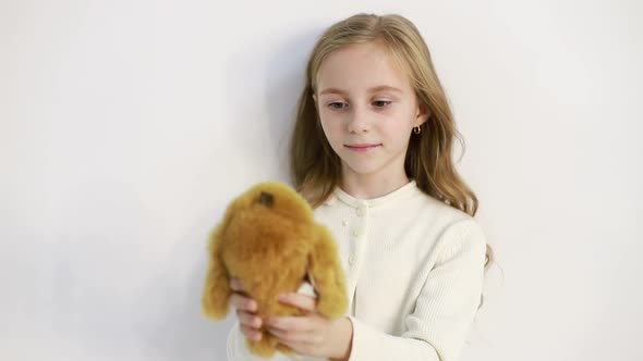 A Child with a Bear in Her Hands a Little Girl Holds a Teddy Bear in Her Hands