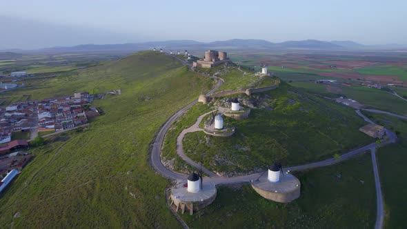 Consuegra Windmills at the Castle of La Muela. Drone Shot Of Spain.