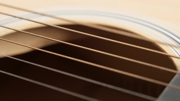 Close-up of  acoustic guitar plucked E string vibration 4K 2160p 30fps UltraHD footage - Details of 