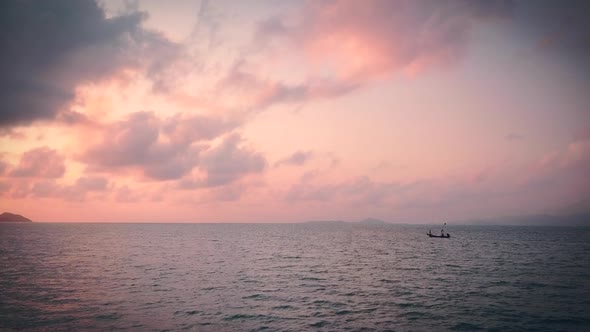Fisherman Boat Sailing at Beautiful Pink Sunrise Koh Phangan  Thailand
