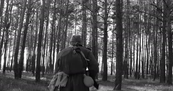 Russian Soviet Infantry Red Army Soldiers Of World War II with Weapons Running On Forest Battlefield