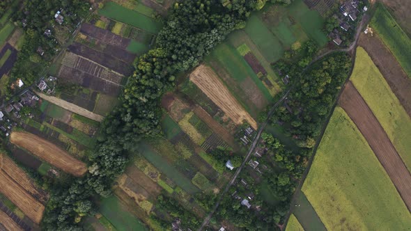 Aerial Top View of Fields in Countryside During Cloudy Day