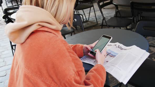 Beautiful Young Businesswoman Wearing White Shirt and Using Modern Smartphone While Walking at