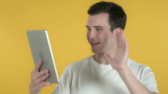 Video Chat By Man Via Tablet, Yellow Background