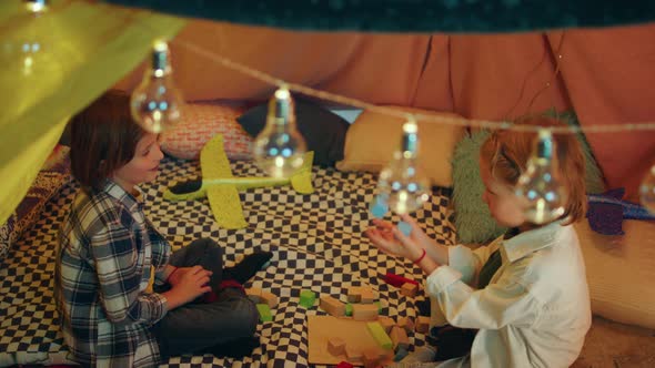 Two Boy Buddies are Playing with Building Blocks