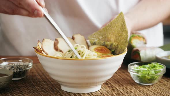 Japanese Ramen Asian Soup Noodle with Beef or Chicken Meat Mushroom and Eggs Chef Cooking