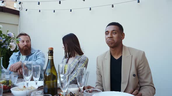 Family and friends having dinner together