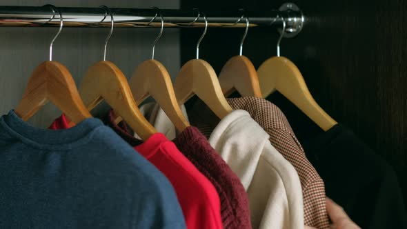 Woman Takes Clothes From your Wardrobe in Home