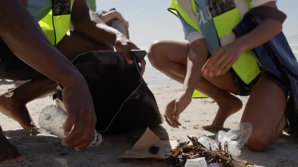 Volunteers cleaning beach on a sunny day 4k