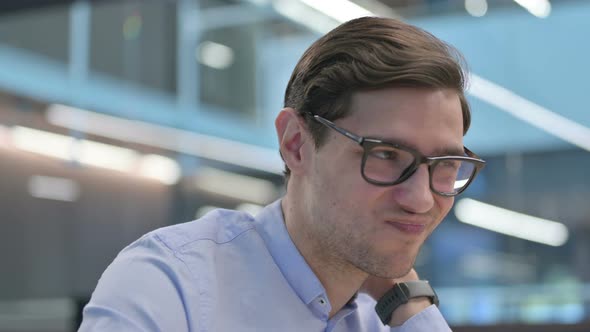 Close Up of Tired Young Man Having Neck Pain