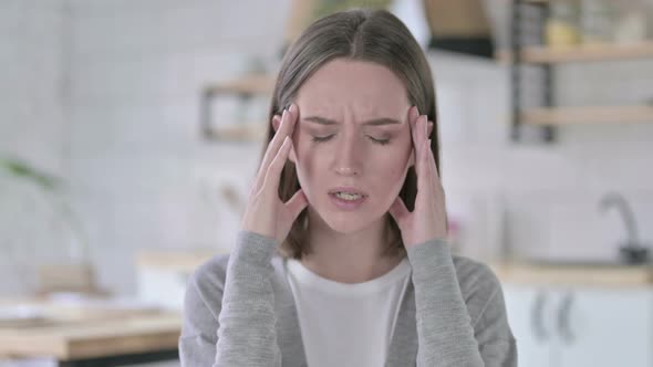 Portrait of Tired Young Woman Having Headache