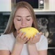 Woman Sniffs Fresh Yellow Mango - VideoHive Item for Sale