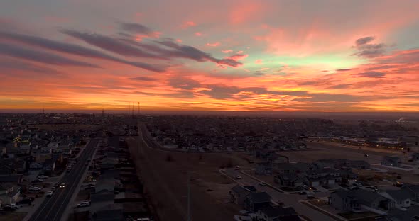 A lateral pan drone shot of a cinematic sunrise over Northern Colorado