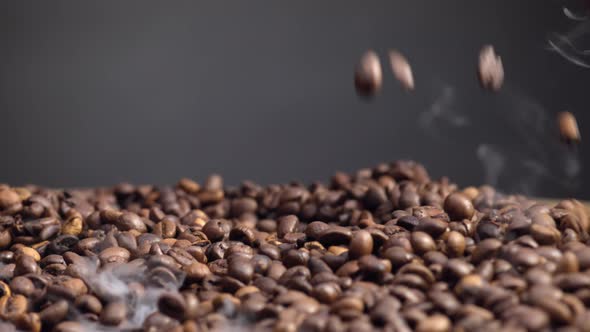 Fragrant Coffee Seeds Falling Down on Pile Closeup