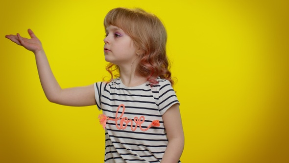 Romantic Smiling Little Kid Child Girl Sending Lots of Air Kisses Looking at Camera and Smiling