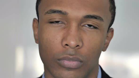 Close Up of Face of Casual Afro-American Businessman Looking at Camera