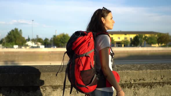 Portrait of female tourist with mobile phone