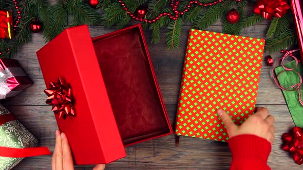 Woman hands packing gift