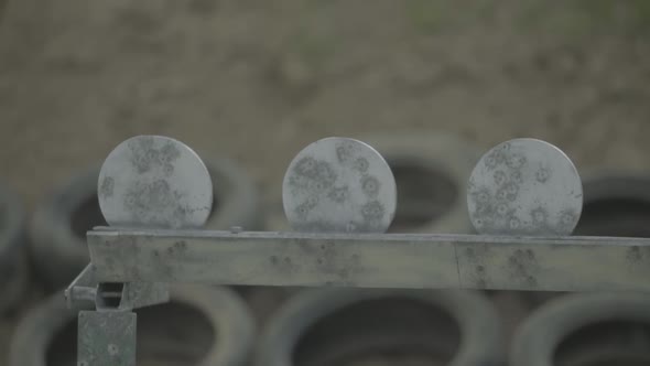 Iron Targets During the Shooting. Slow Motion.