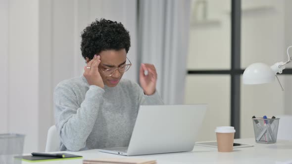 African Woman Having Headache While Using Laptop 