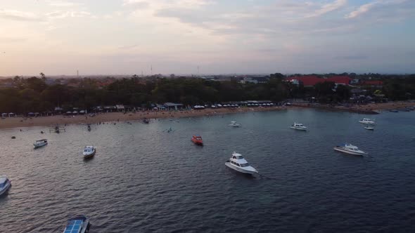 Drone Fly Over Boats Near to Beach on Sunset