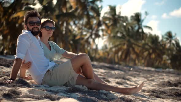 Happy Romantic Couple Enjoying Relaxing Ocean On Caribbean Resort. Honeymoon Holidays On Maldives.