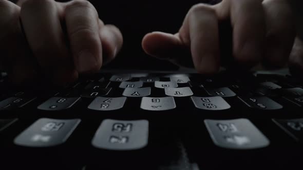 Closeup Typing on Keyboard with Man Fingers
