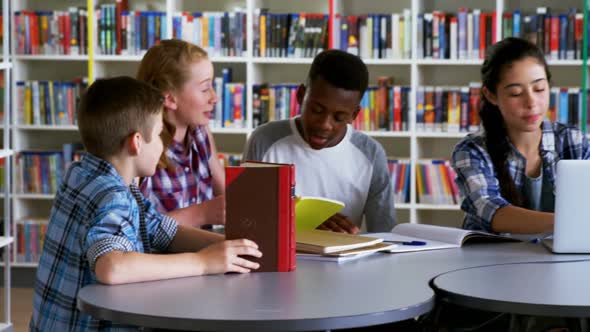 Schoolkids studying in library 4k