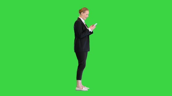 Pretty Young Blonde Woman Viewing Latest News and Being Surprised on a Green Screen Chroma Key