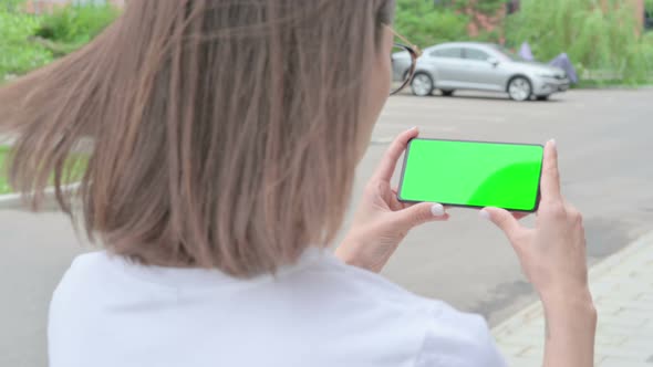 Walking Woman with Green Screen Smartphone